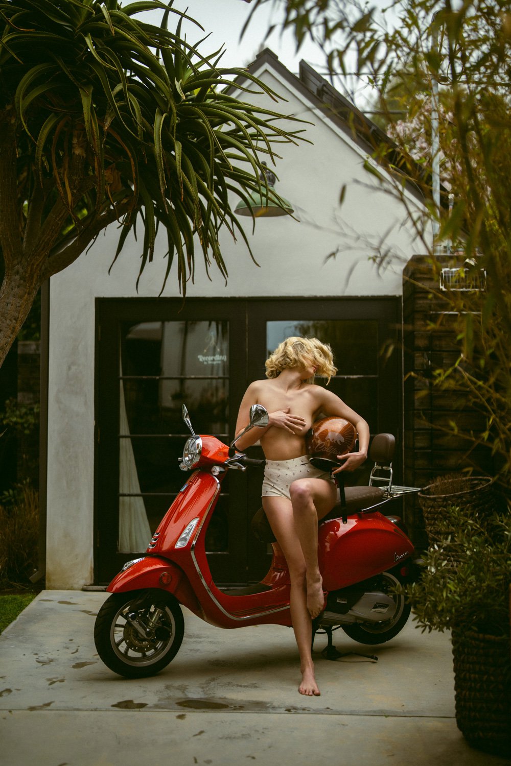 Boudoir model with Roxy Sprocket the red Vespa photo prop at the Bungalow